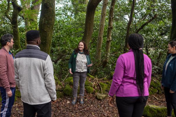 Group of people enjoying a talk with Ann Ward from Xhale Mindfulness