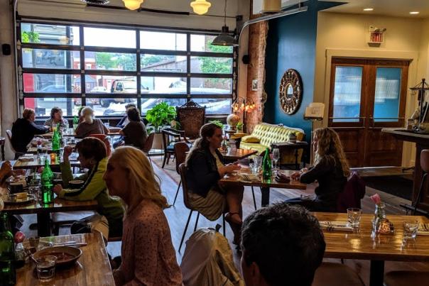 interior photo of the baker's table in newport kentucky with large airy windows and a fun atmosphere