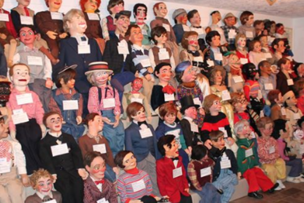 A wall of ventriloquist dummies at Vent Haven Museum