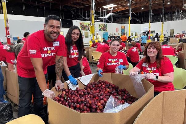 Volunteers packaging fruit