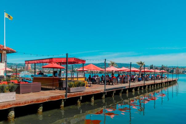 Lake Chalet dining on the water under shade umbrellas