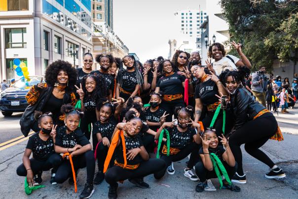 Group of friends posing in the Black Joy Parade by Sabrina Sellers