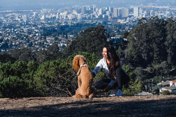 Joaquin Miller Park woman with their dog overlooking the city of Oakland