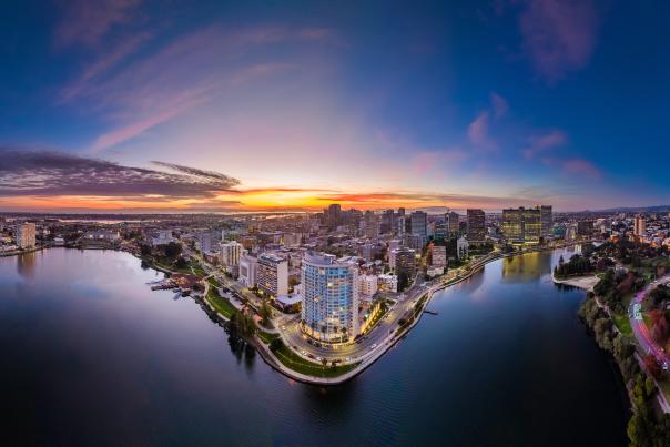 Aerial shot of Lake Merritt with Downtown Oakland in the background during a sunset