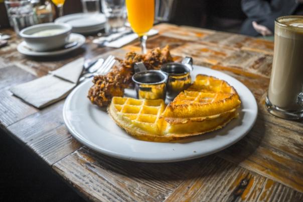 A table plated with breakfast waffles from Brown Sugar Kitchen in Oakland, CA