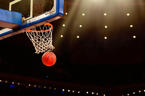 Basketball going through the baskeball hoop