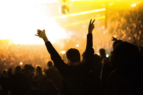 Person enjoying a concert at the Oakland Arena in Oakland California