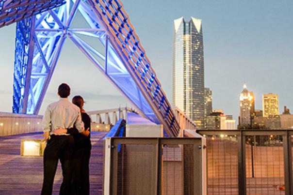 Couple standing on the Skydance Bridge in OKC