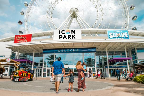 Family in front of The Wheel at ICON Park