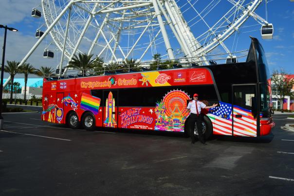 City Sightseeing tour bus parked in front of The Wheel at ICON Park