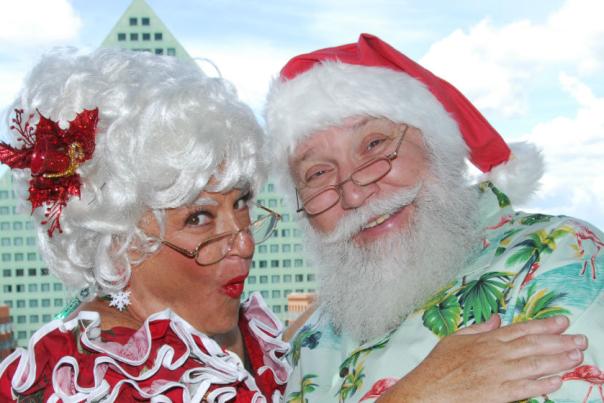 Santa and Mrs. Clause in front of the Walt Disney World Swan and Dolphin Resort