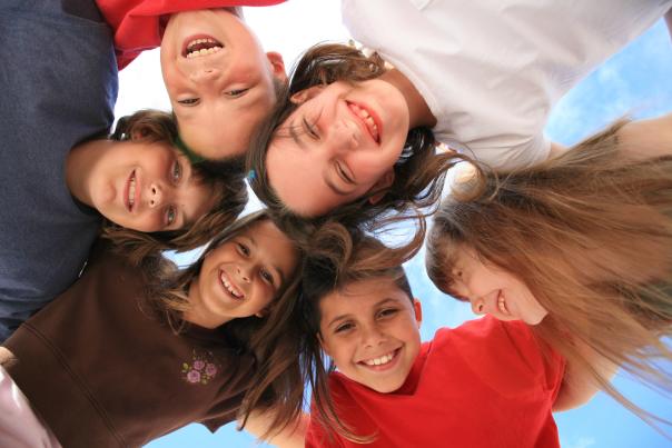 a group of six kids smiling