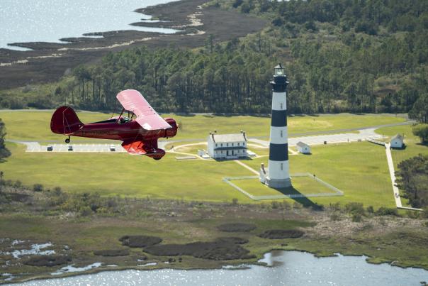 obx airplanes biplane fly lighthouse aerial