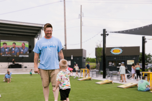 Father and son playing yard games at SERV