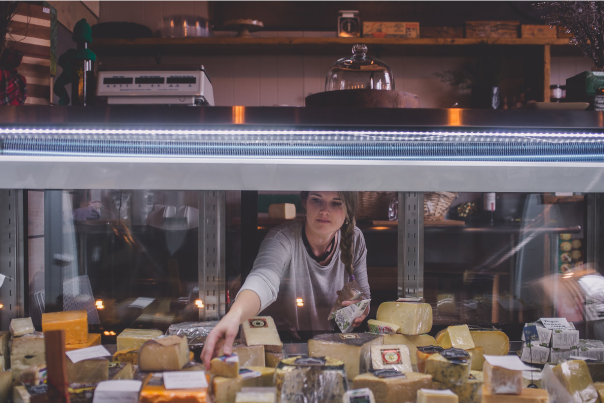 Wine Cellar & Cheese Shop Woman Counter