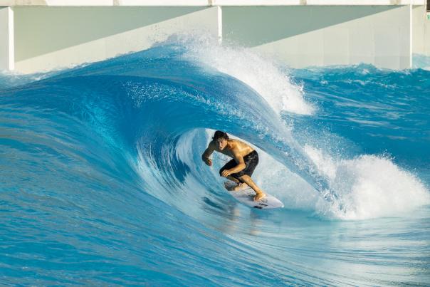 Surfer in barrel wave.