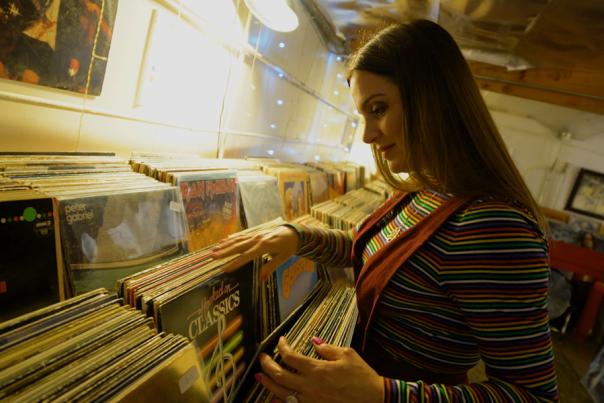 Woman looking at vinyl collection