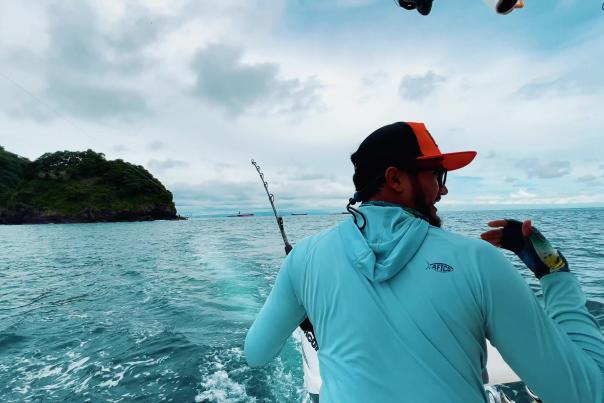 A fisher man o a boat navigating on Pear Islands