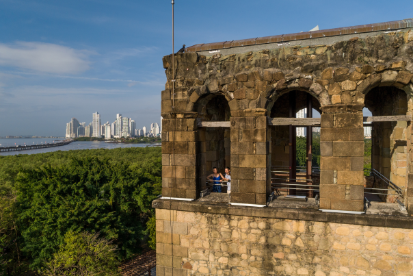 View of Panama Viejo tower in contrast with the modern skyline of the city