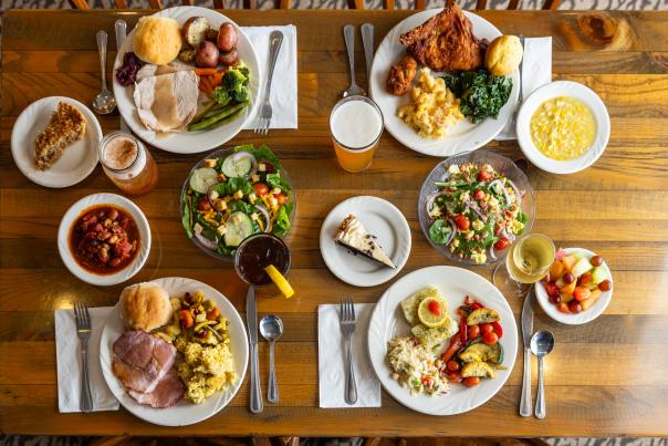 Birds eye view of plates of food set on a dining table