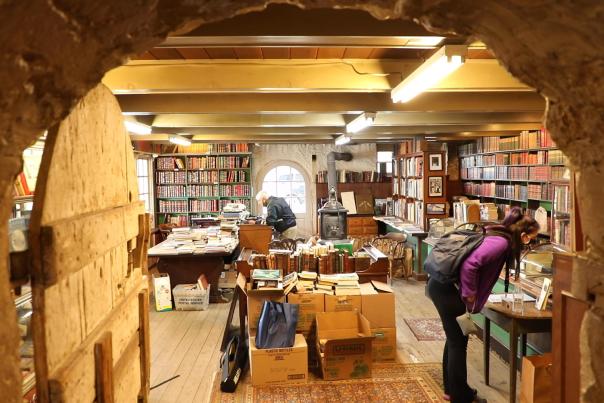 People looking at table displays of books in Baldwin's Book Barn in West Chester