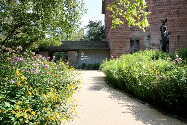 Path leading up to the entrance of a museum with signage that reads Brandywine Museum of Art