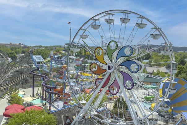 Aerial view of an amusement park with a large Ferris wheel