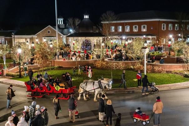 Aerial view of people and horse drawn carriages during the holidays in Ligonier's downtown