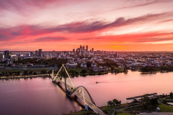 Pink sunset over Perth City skyline and Matagarup Bridge