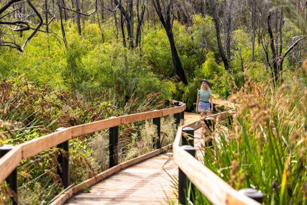 Girl walking along a boardwalk in the Yanchep National Park