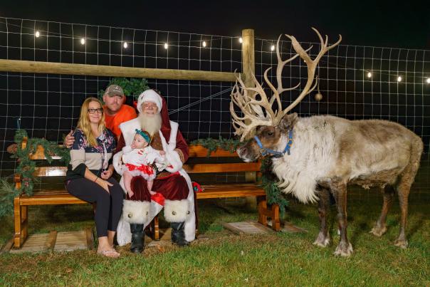 A family visits with Santa at Spruce Ridge Reindeer in the Poconos.