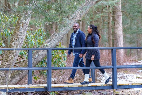 A couple enjoys a romantic hike at Skytop Lodge in the Poconos