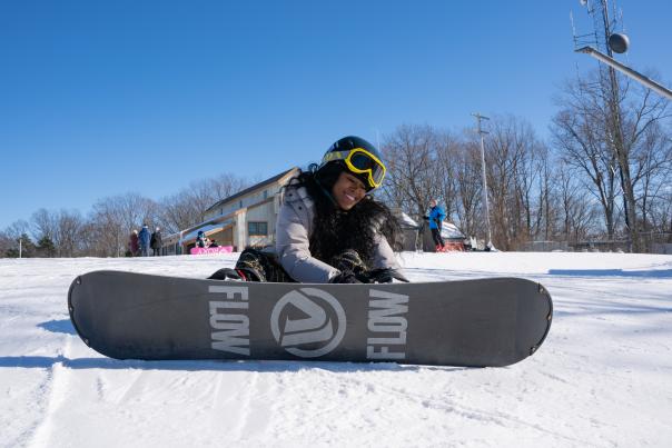 A woman gets ready to go snowboarding at Shawnee Mountain Ski Area