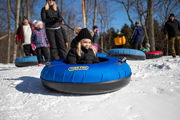 A girl prepares for a snow tubing ride down the hill in the Poconos!