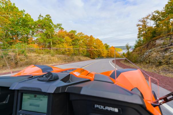 A view of fall foliage in the Pocono Mountains from the passenger seat of a Pocono Slingshot driving tour.