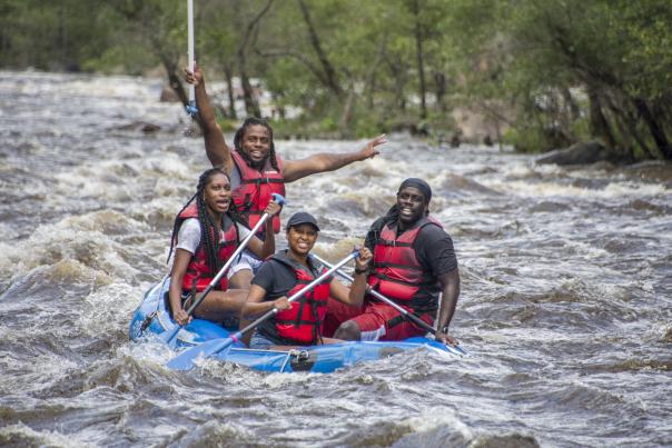 A group enjoys whitewater rafting on the Lehigh River int he Poconos