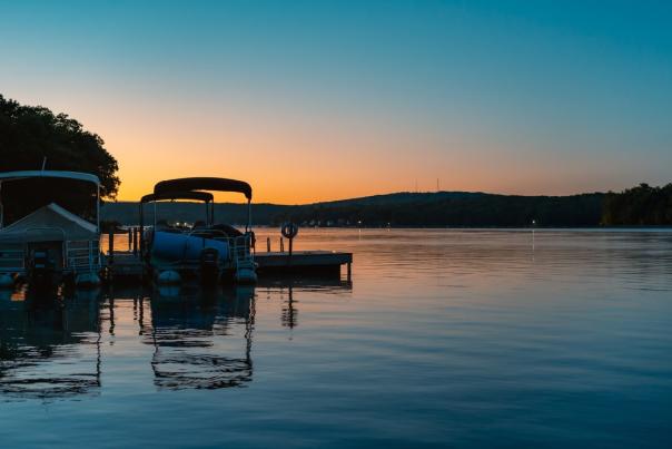 A beautiful sunset over the boats bobbing on Lake Wallenpaupack in the Poconos