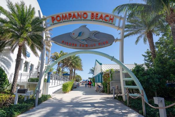 An archway at the entrance to the Pompano Beach Fisher Family Pier.