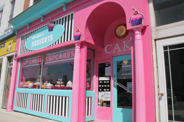 A bright pink storefront with light blue accents.