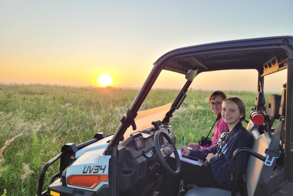 Summer 2024 Intern Dakota Dyer on an early morning bird survery with volunteer Tisha Tolle