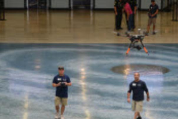 Image of video crew operating a drone camera.