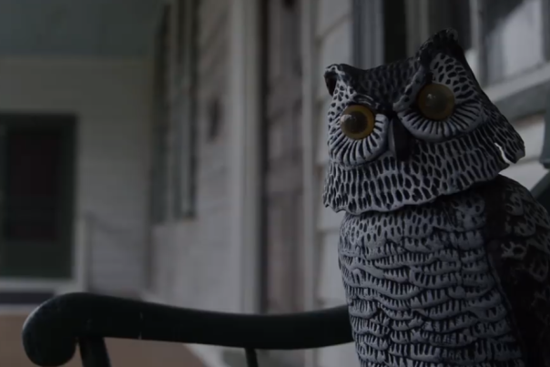 owl figurine on a bench