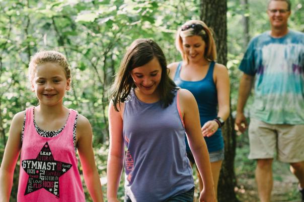 family hiking in the woods