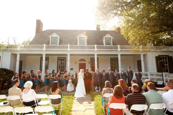 Couple getting married in front of a crowd of guests at Rippon Lodge