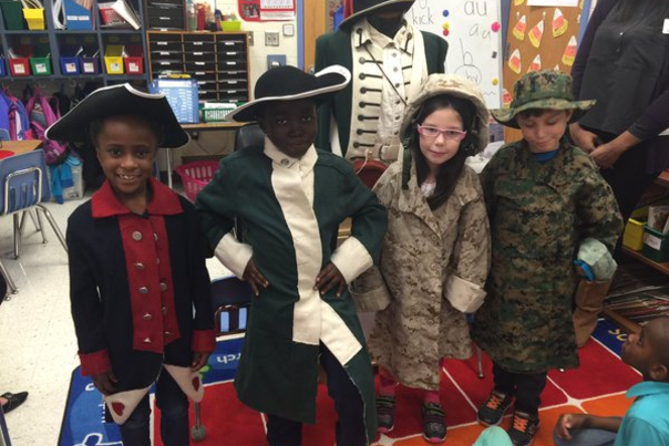 Kids in period costumes from the travel trunks education programs from Marine Corps Museum