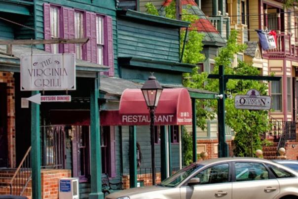 Storefronts with cars parked outside
