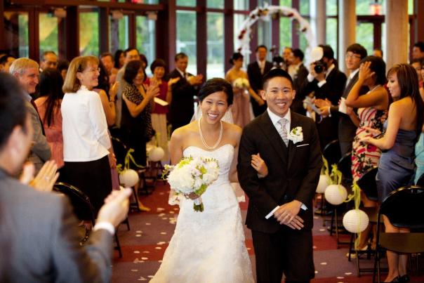 Asian Couple walking down isle for wedding