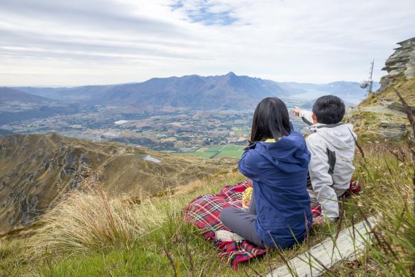 Sightseeing from Coronet Peak in summer with a picnic