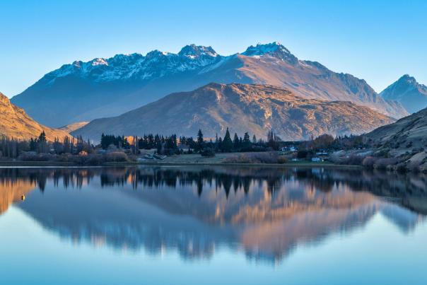 Snow capped mountain reflections on Lake Hayes in winter