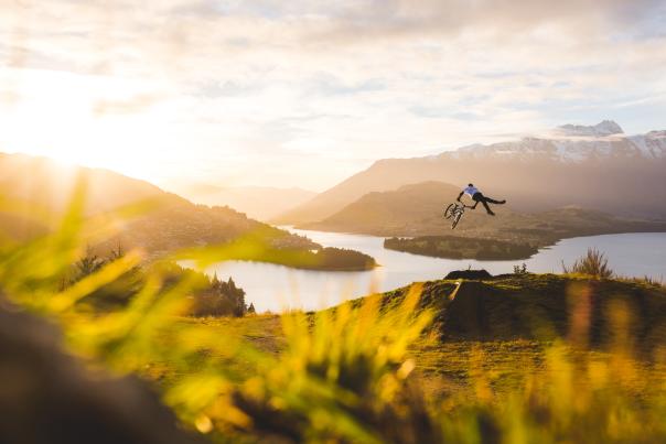 Mountain Biker Jumping in Queenstown New-Zealand